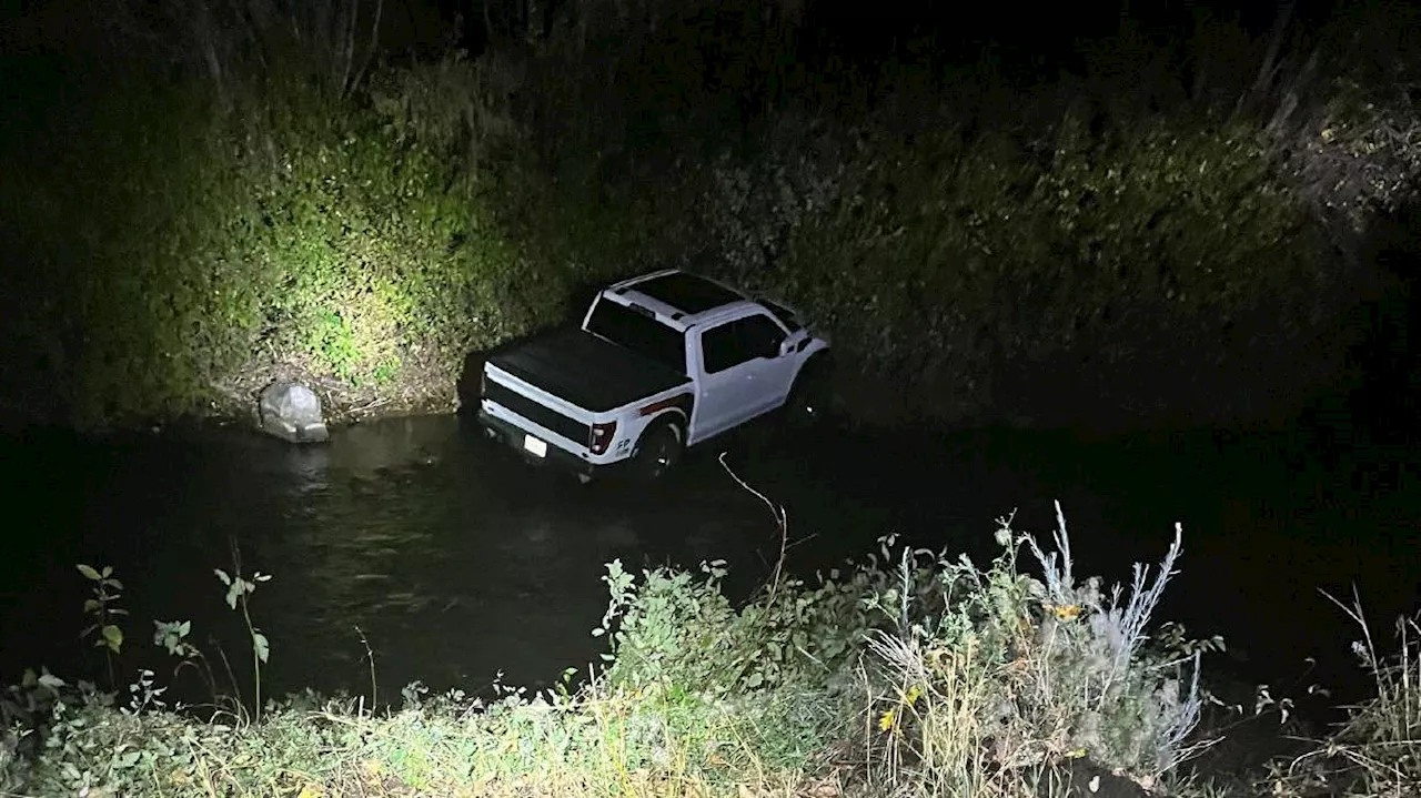 Woman stole car at gunpoint, drove it into Provo River, police say