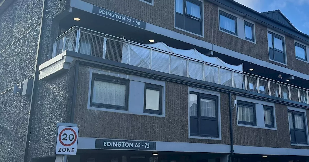 Murder probe launched as screen erected on balcony at block of flats