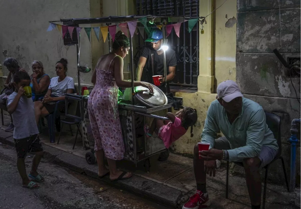 Cuba fights to come back from a nationwide blackout, then a storm that killed six