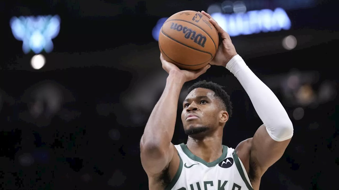 Two-time MVP Giannis Antetokounmpo shakes off knee woes to play opening night for Bucks