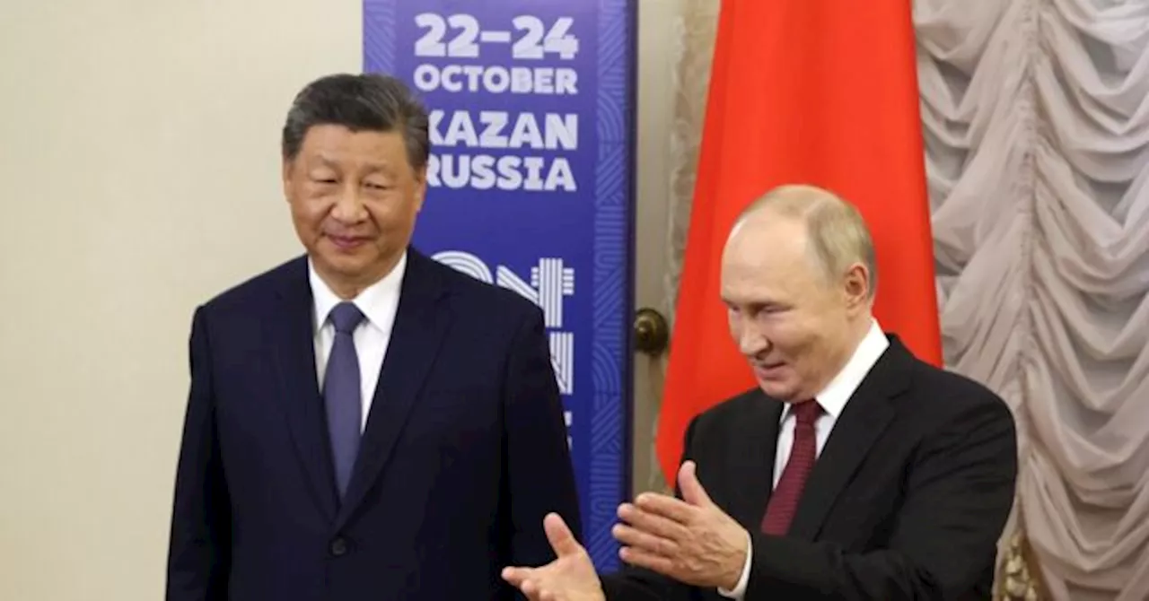 Best Friends: Putin Gives Xi Jinping Top Billing at Anti-U.S. BRICS Summit
