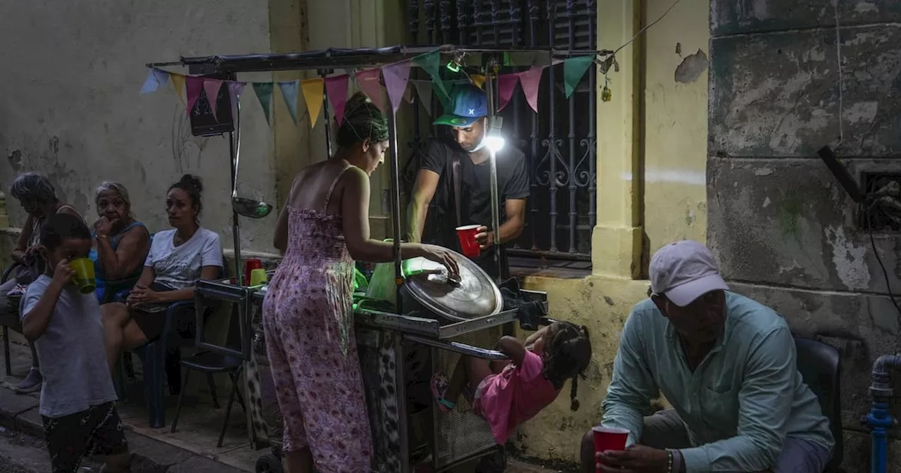 Cuba fights to come back from a nationwide blackout, then a storm that killed 7