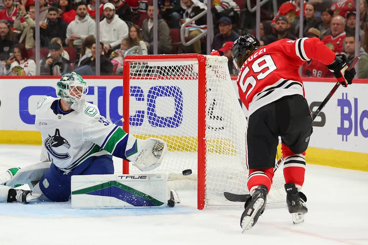 Heinen scores twice as the Canucks beat the Blackhawks 6-3 for their third straight win