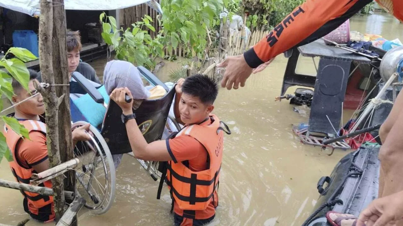 Tropical storm battering Philippines leaves at least 23 people dead in flooding and landslides