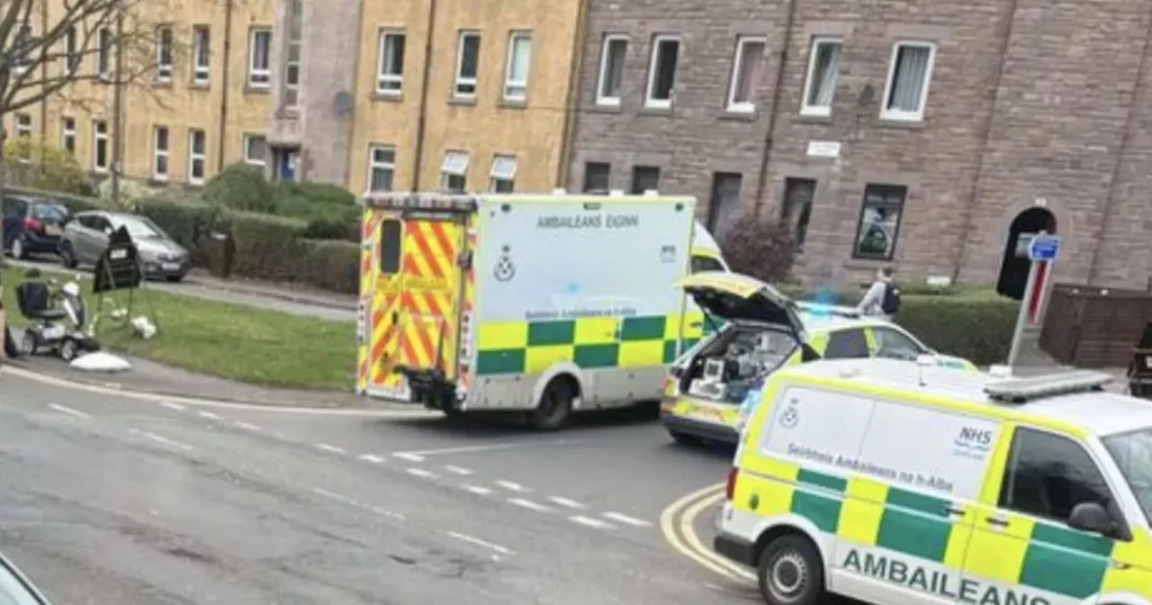 Pensioner dies in Edinburgh street as police block off road