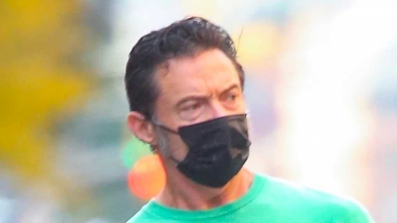 Hugh Jackman shows off his buff biceps while running errands in New York City