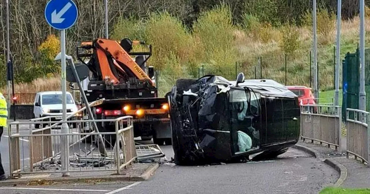 Car flips after smashing into East Kilbride barrier outside primary school