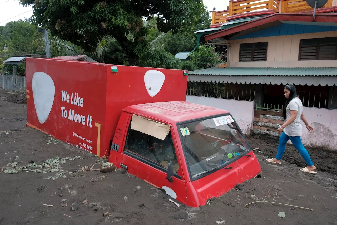 Flood, mudslides kill at least 2 dozen people in the Philippines