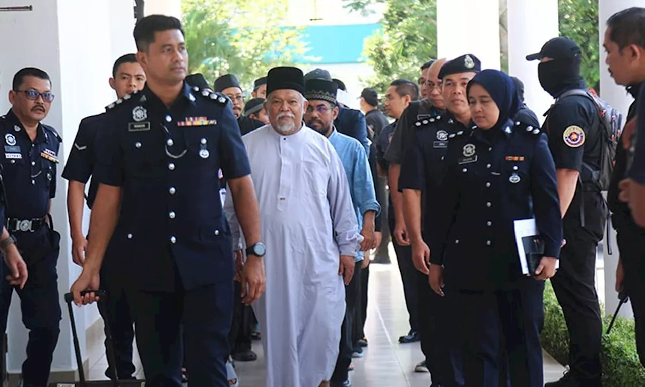 Malaysia charges 22 members of an Islamic business group, including its CEO, for organized crime