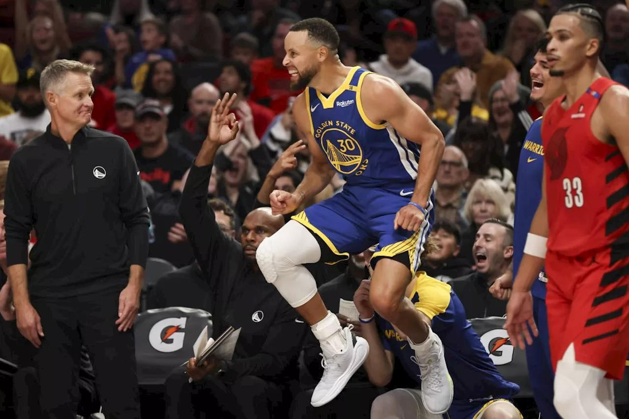 Curry leads Golden State Warriors in 139-104 season-opening rout of the Portland Trail Blazers