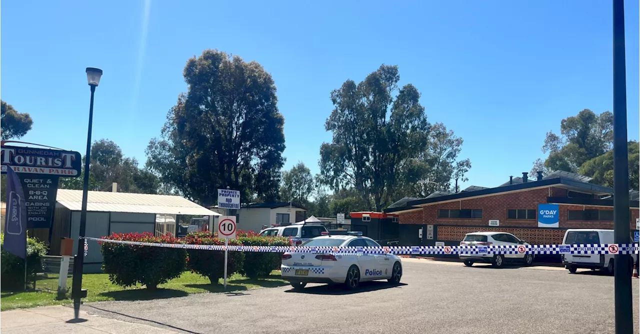 Man covered in blood arrested after woman found dead in tent at NSW caravan park