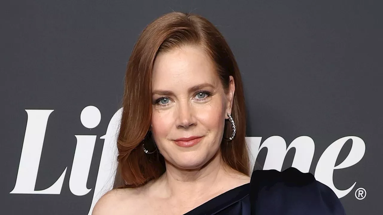 Amy Adams stuns in an elegant blue satin look as she joins Selma Blair and Zoe Saldana at Variety's...