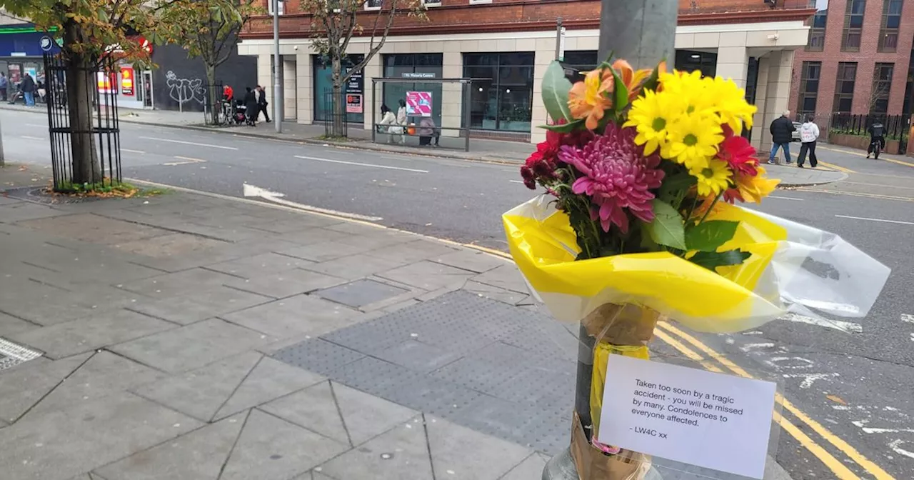 Floral tributes at scene of bus crash which killed woman in 30s