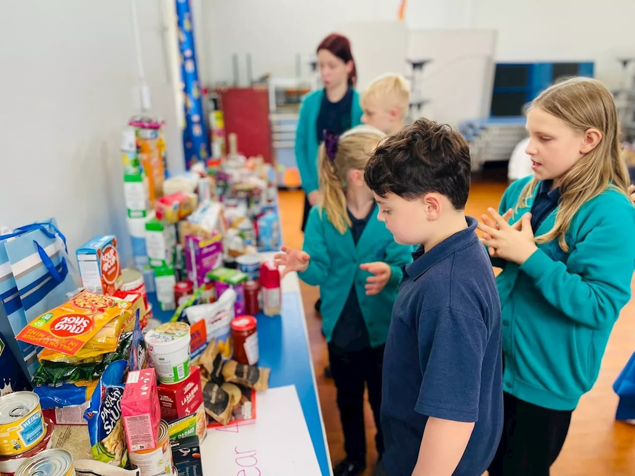 School pupils in Much Wenlock build harvest donation tower for local food bank