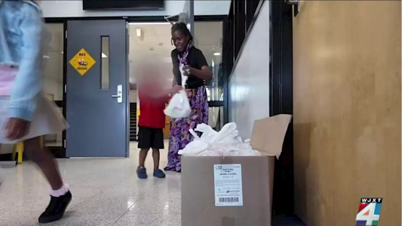 Jacksonville woman goes back to elementary school to give away clothes, food to students