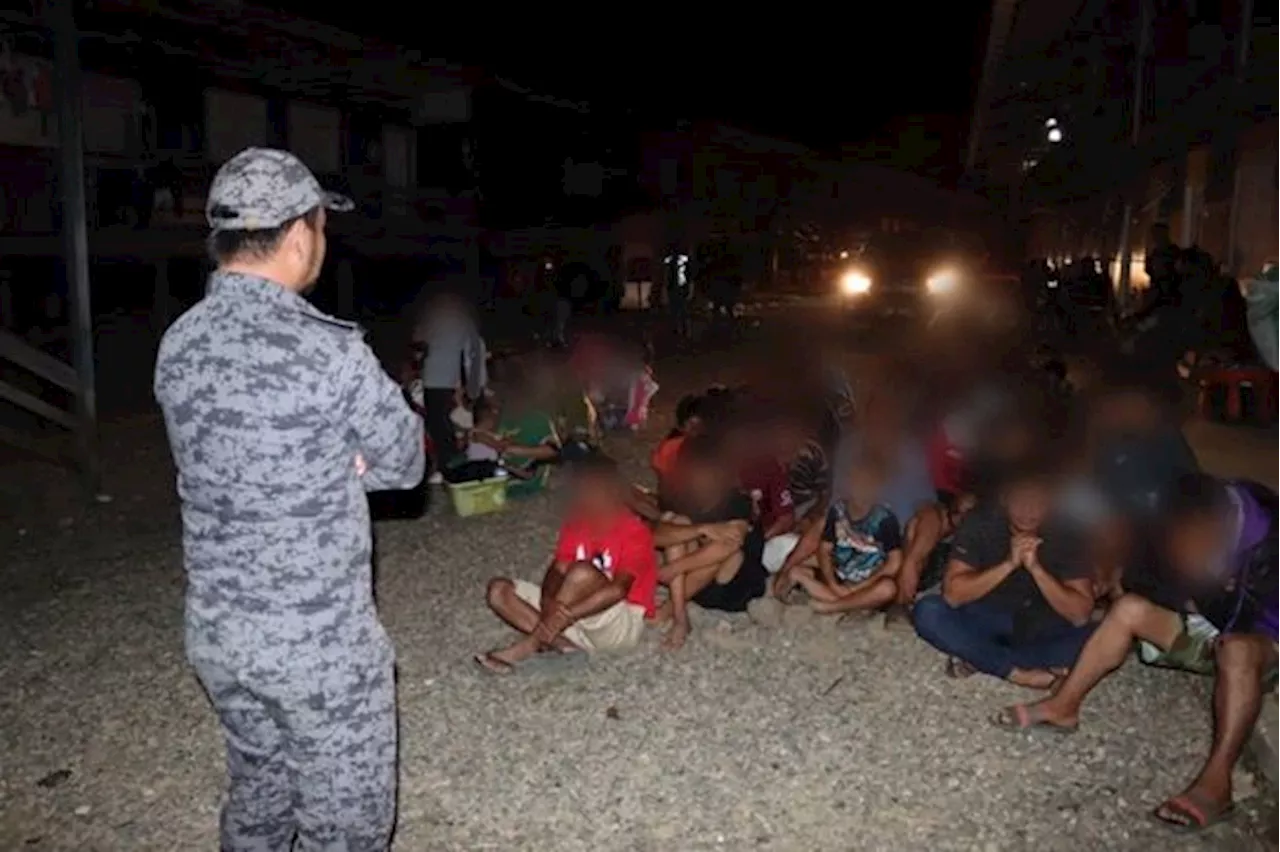 Some 145 undocumented migrants nabbed in remote Sabah village