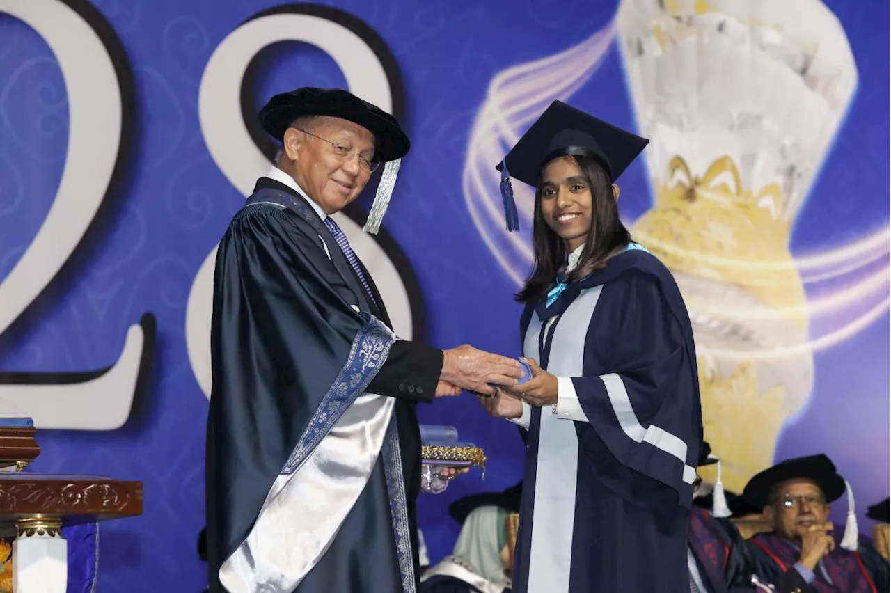 Thinaah graduates with teaching degree