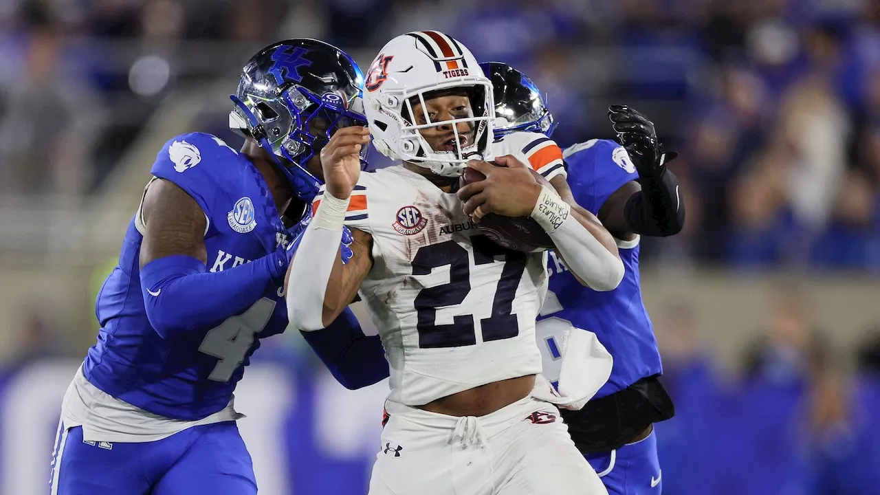 Which Auburn players had the highest and lowest Pro Football Focus grades vs. Kentucky?