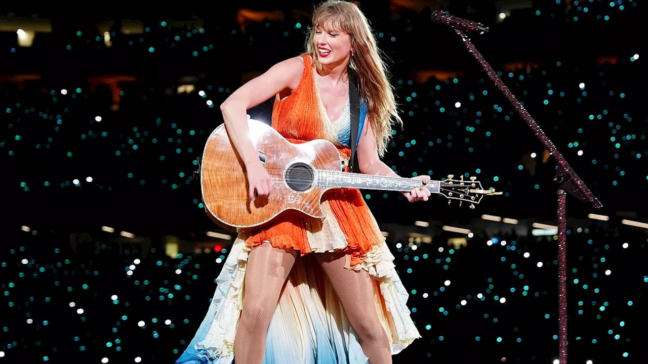 Taylor Swift unveils new koi fish inspired dress during surprise song set at New Orleans Eras Tour...