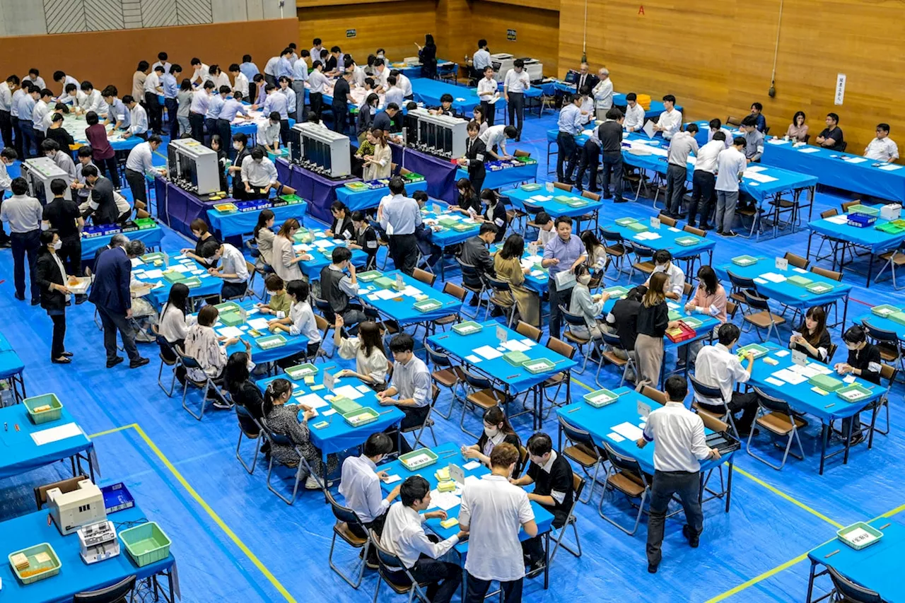 Japanese voters set to hand ruling coalition punishing election result