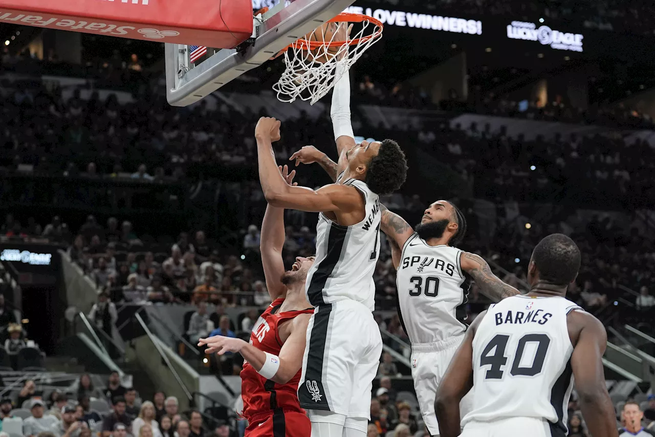 NBA: Spurs hold off late Rockets rally to get first win