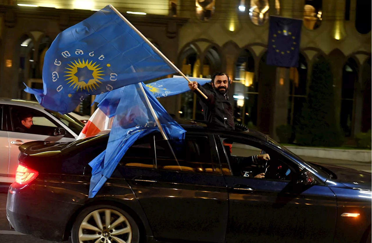 Georgia’s ruling party wins pivotal election, early results show, as opposition parties cry foul