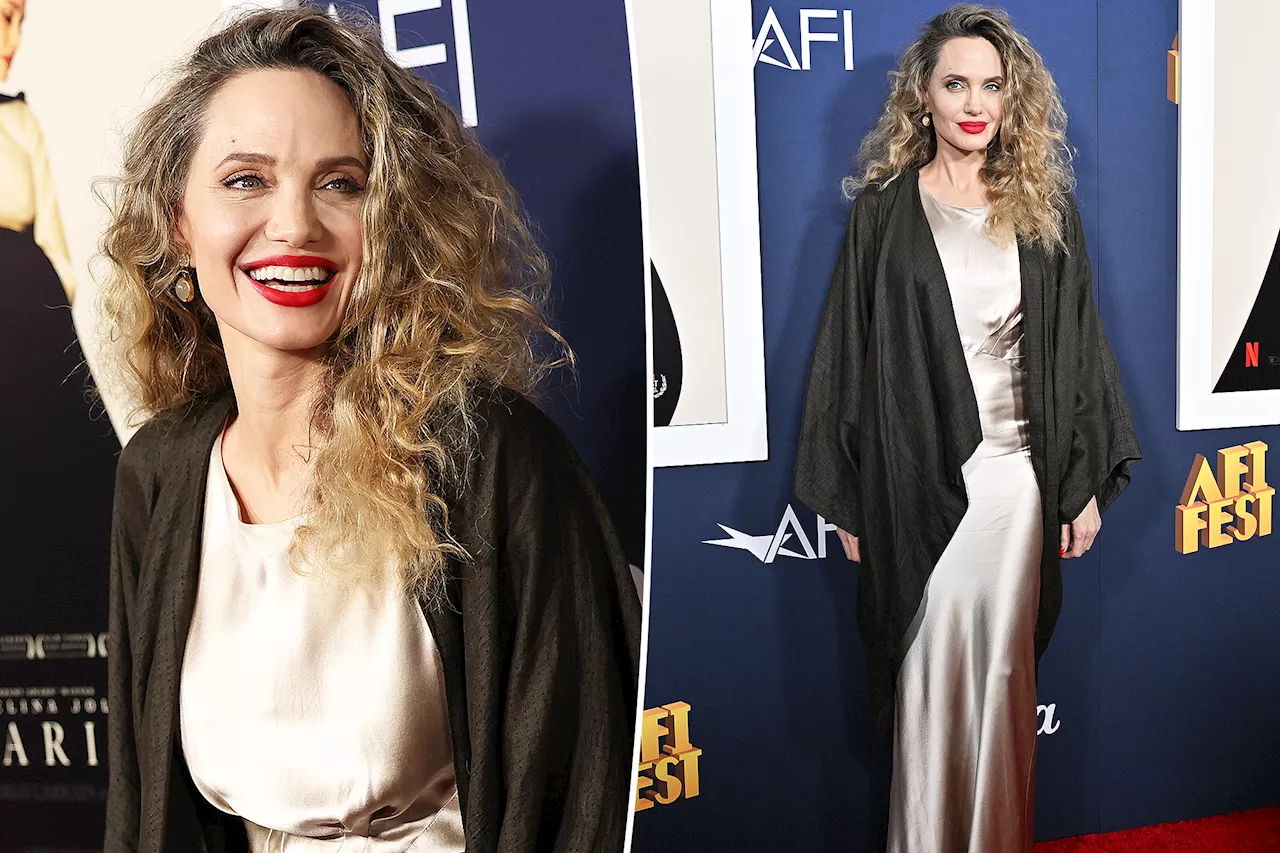 Angelina Jolie rocks wild curly hair and slinky dress at movie premiere