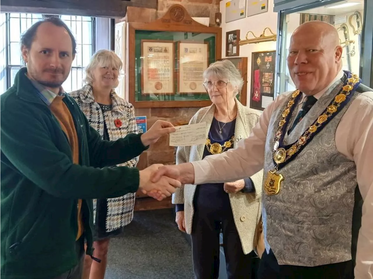 Society donate to chosen charity and get hands-on during castle tour