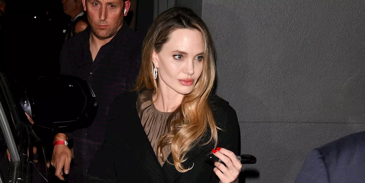 Angelina Jolie Delivers Fall Elegance in a Black Coat and a Silky Brown Dress