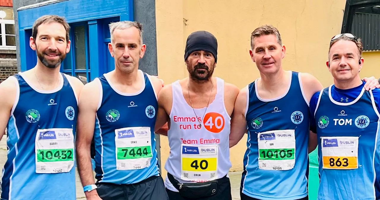 Four gardai flanked Colin Farrell during his Dublin marathon heroics