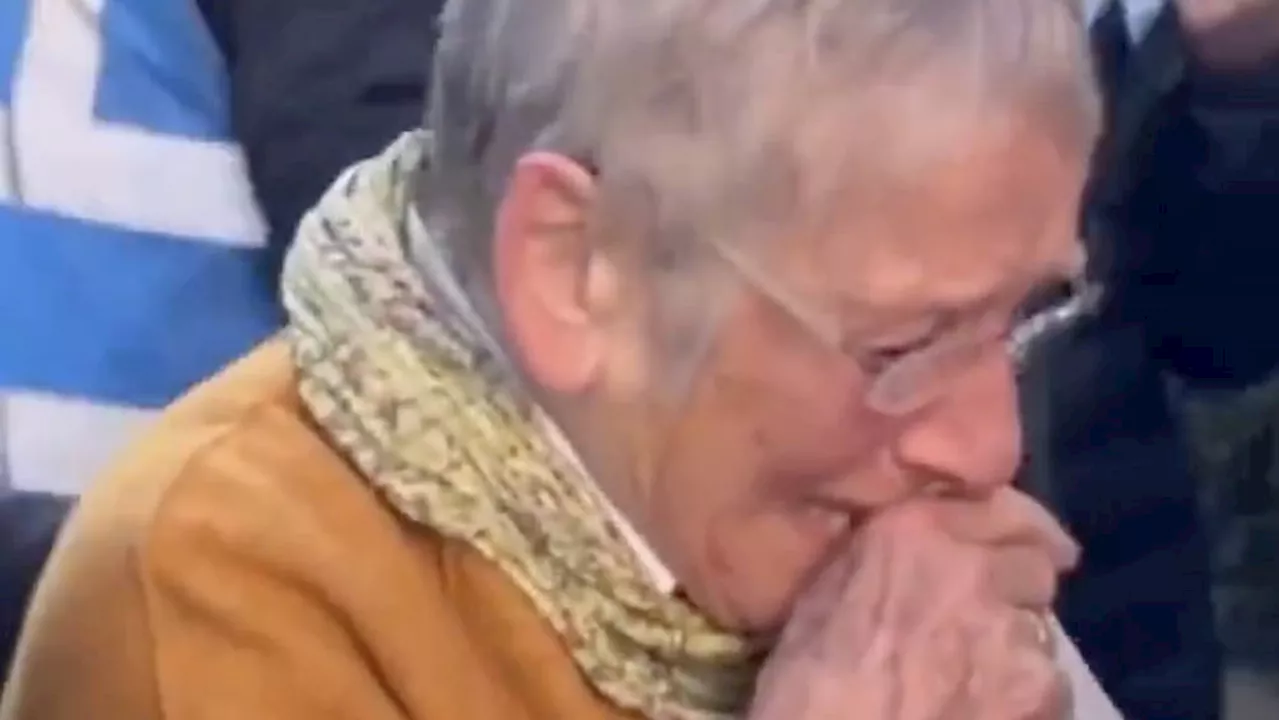 Elderly Jewish woman in tears outside community centre as protesters swarm Middle East peace conference