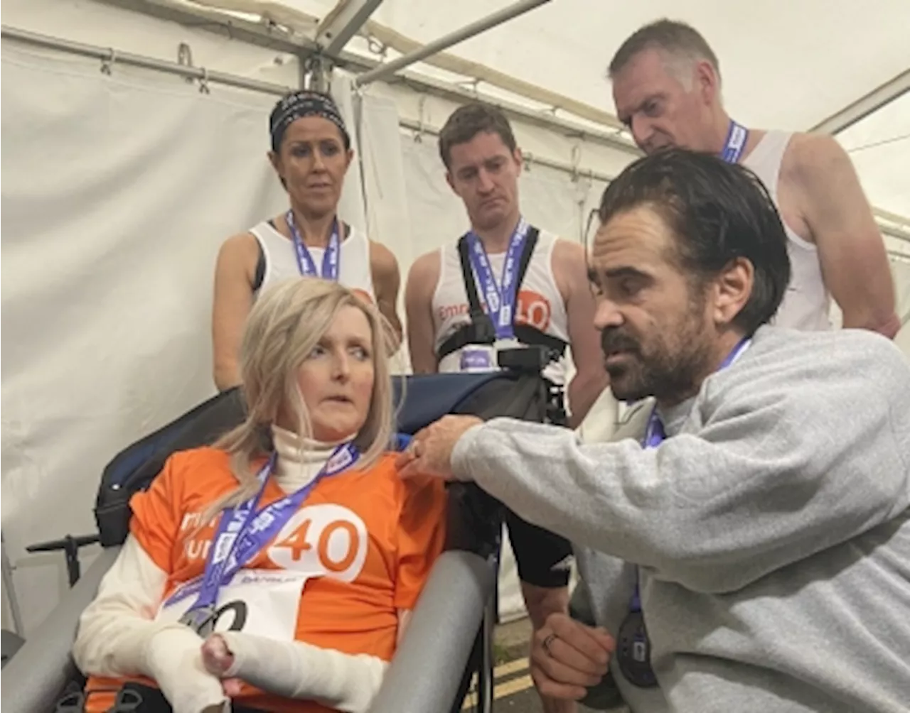 Actor Colin Farrell pushes wheelchair-bound friend through final stretch of Dublin Marathon, raising awareness for rare skin condition (VIDEO)