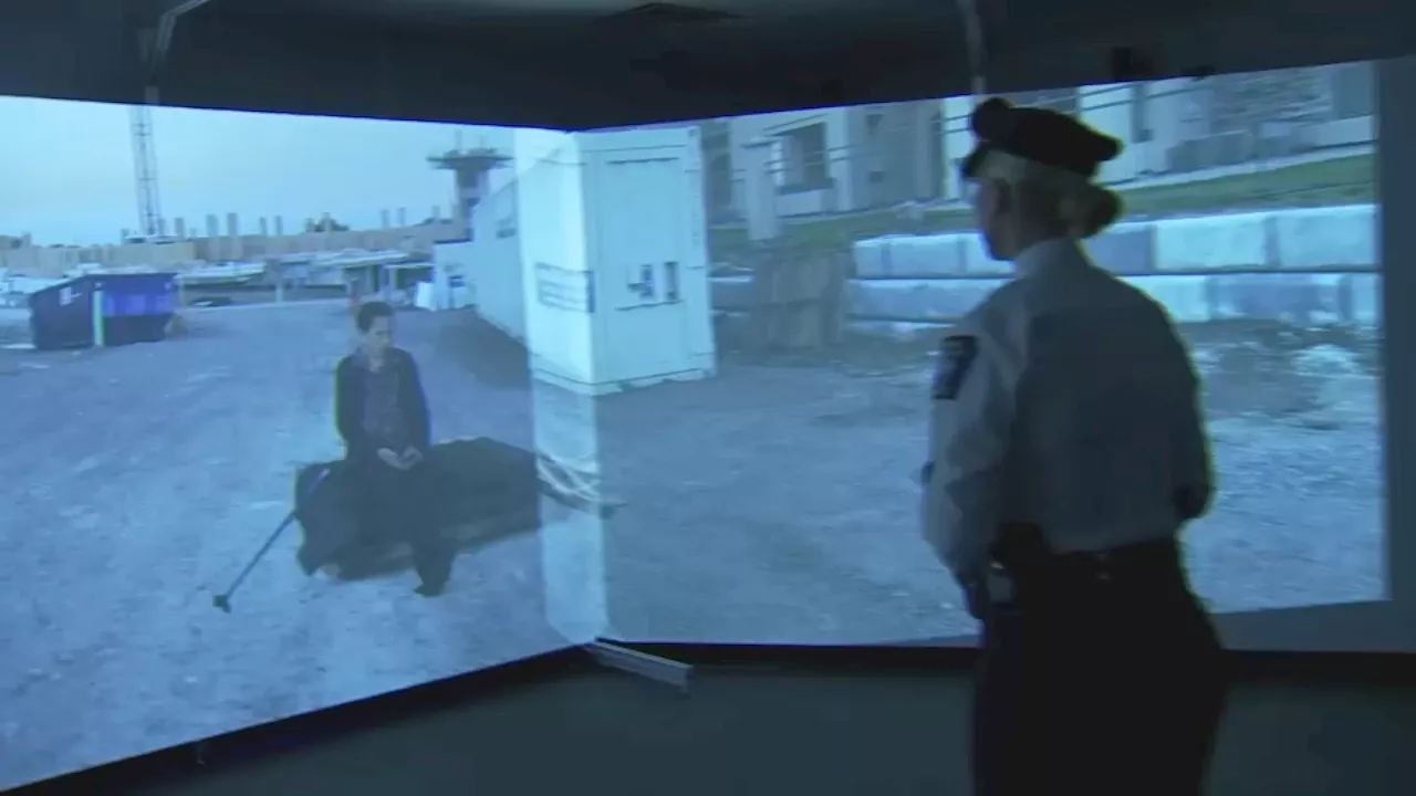 Officers at Temple University doing de-escalation training using simulation