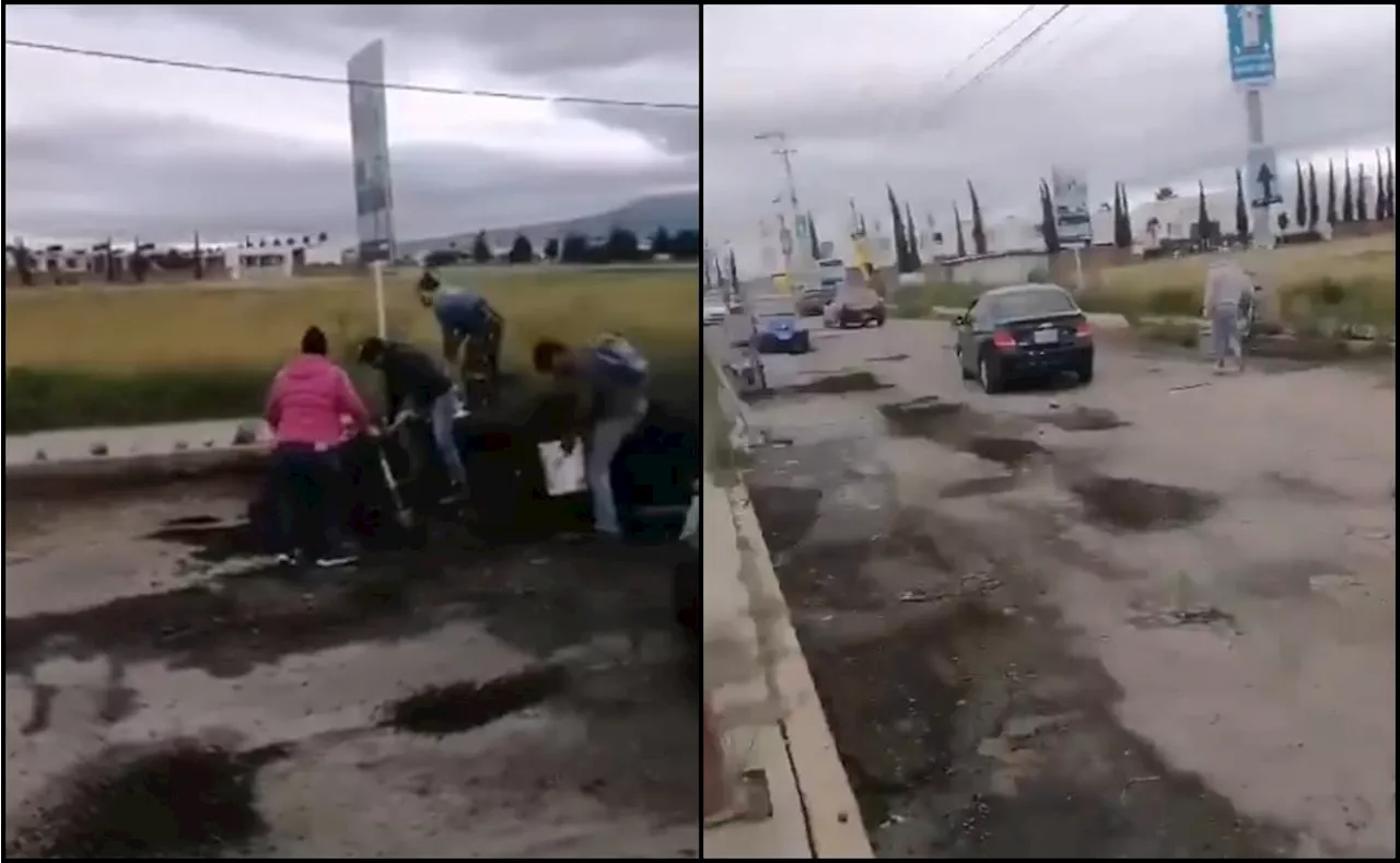 Ante inacción de autoridades, vecinos tapan baches con dinero propio en Coronango, Puebla