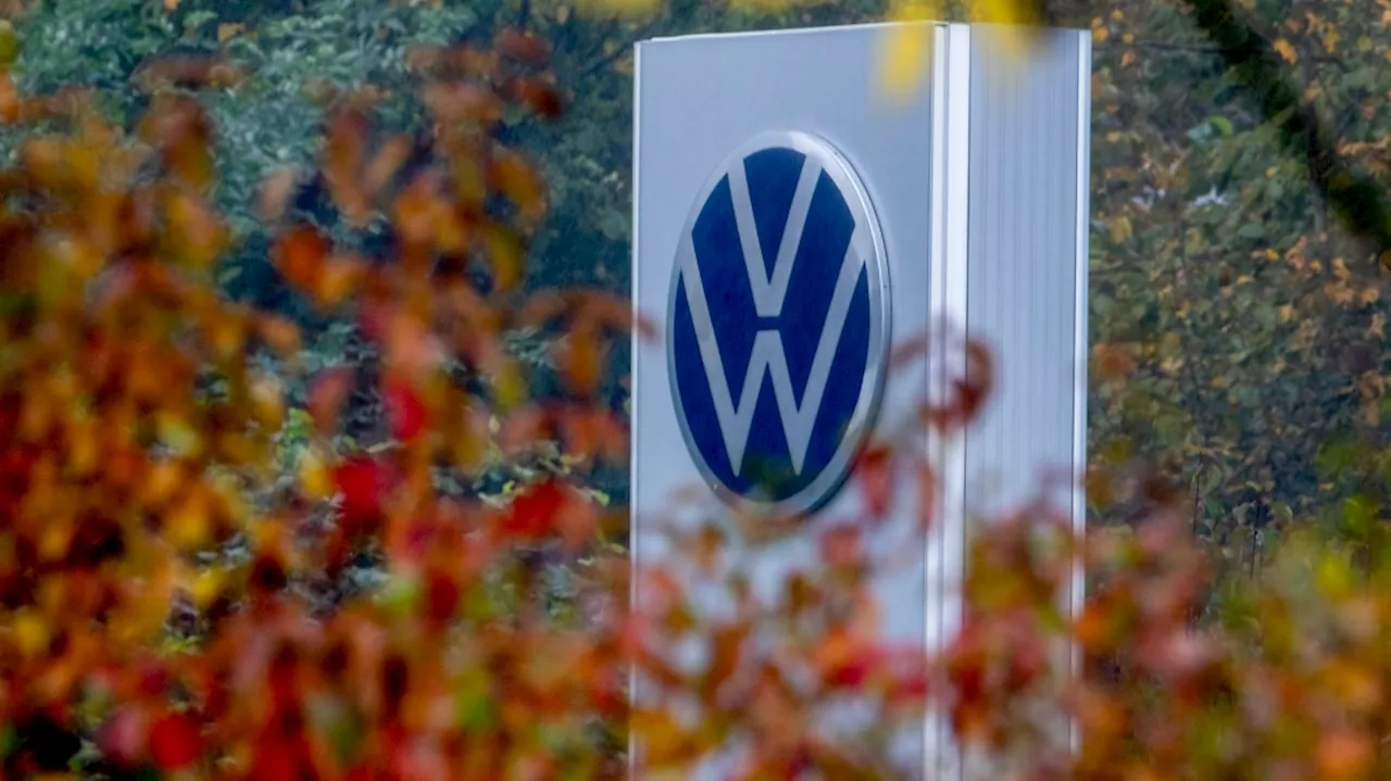 Volkswagen says cost cuts are urgently needed as its earnings decline sharply