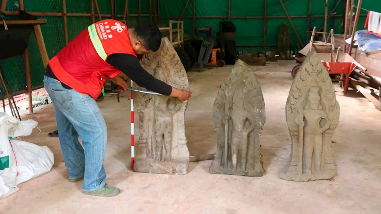 Cambodian archeologists discover a dozen centuries-old sandstone statues at Angkor UNESCO site