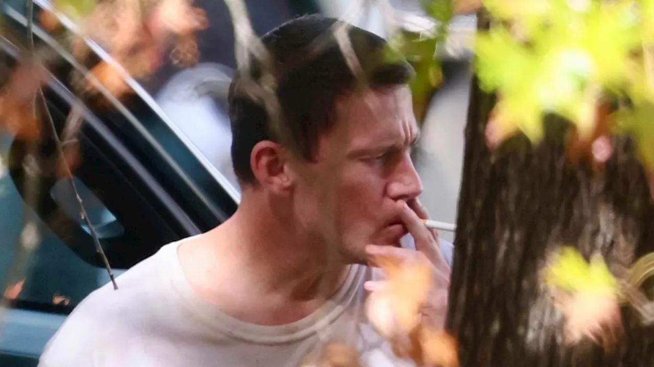 Channing Tatum looks disheveled puffing on a cigarette as Zoe Kravitz smiles after calling off...