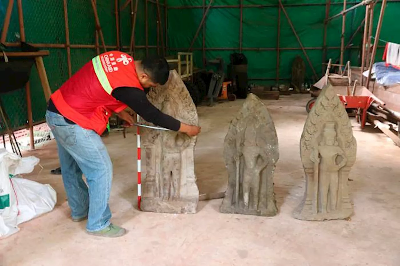 Cambodian archaeologists discover a dozen centuries-old sandstone statues at Angkor UNESCO site