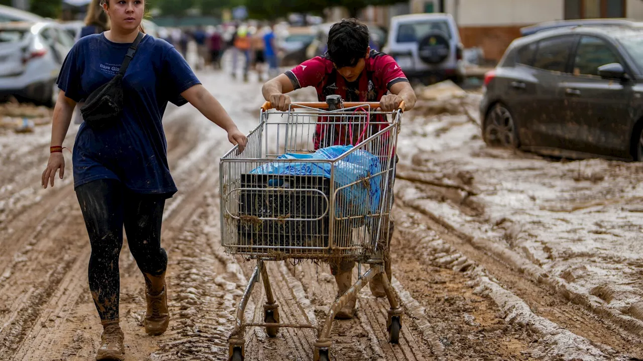 Flood survivors say regional Spanish officials waited too long to warn them of the danger