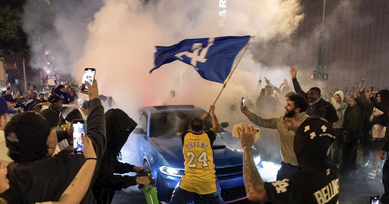 Los Angeles sees city bus burned, store thefts and rowdy crowds after Dodgers win World Series