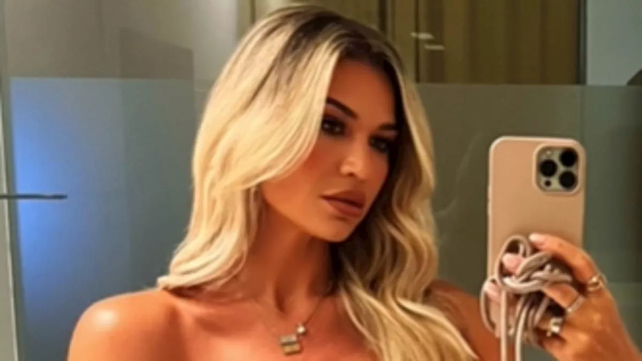 Christine McGuinness wows in a racy strapless leather dress as she poses for sizzling snaps after...