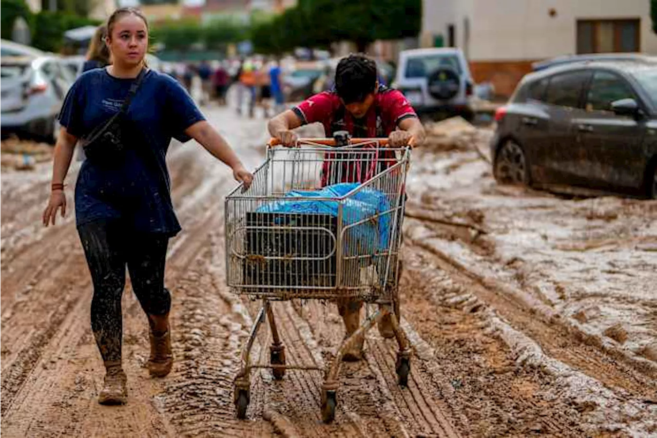 Flood survivors say regional Spanish officials waited too long to warn them of the danger