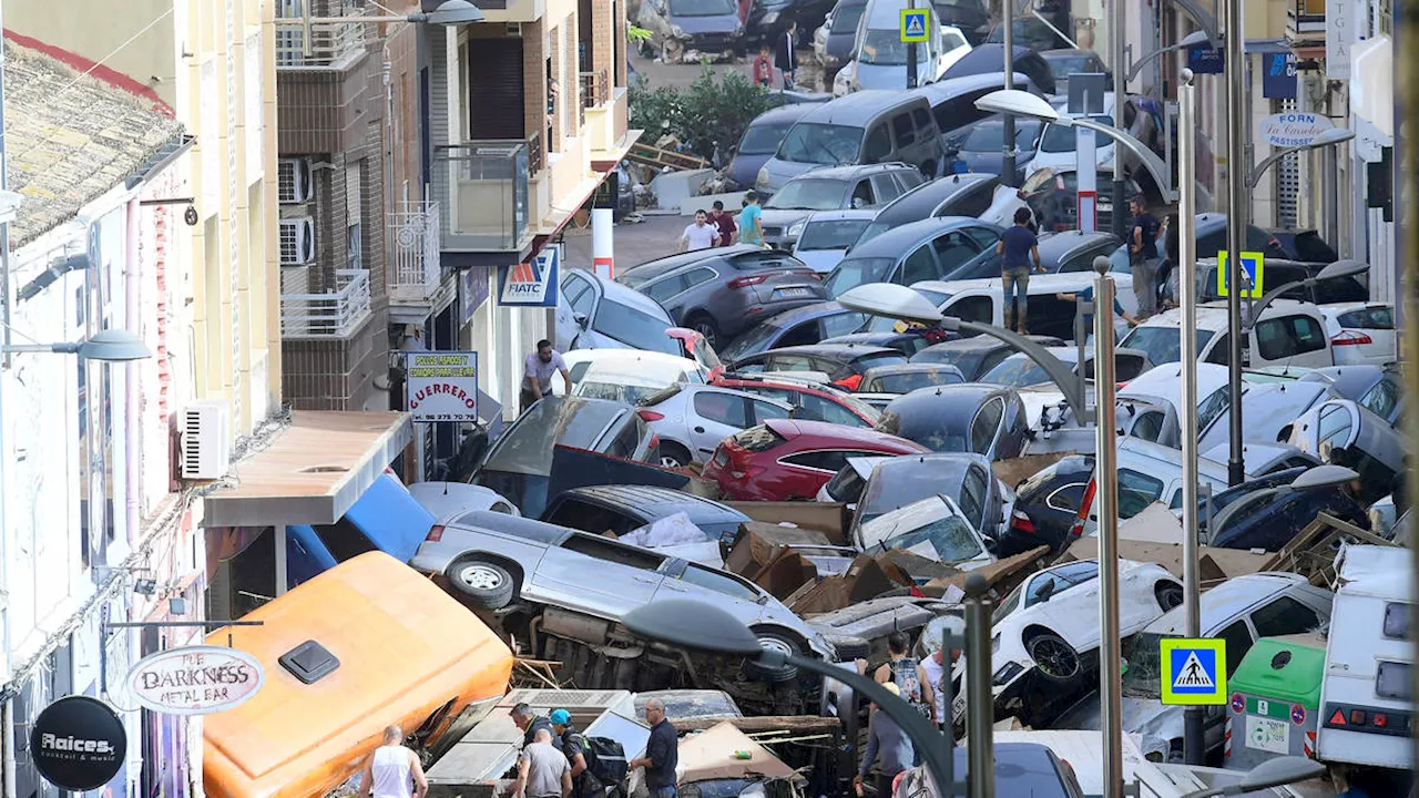 Spanish government declares three days of mourning after 95 die and dozens missing in flash floods