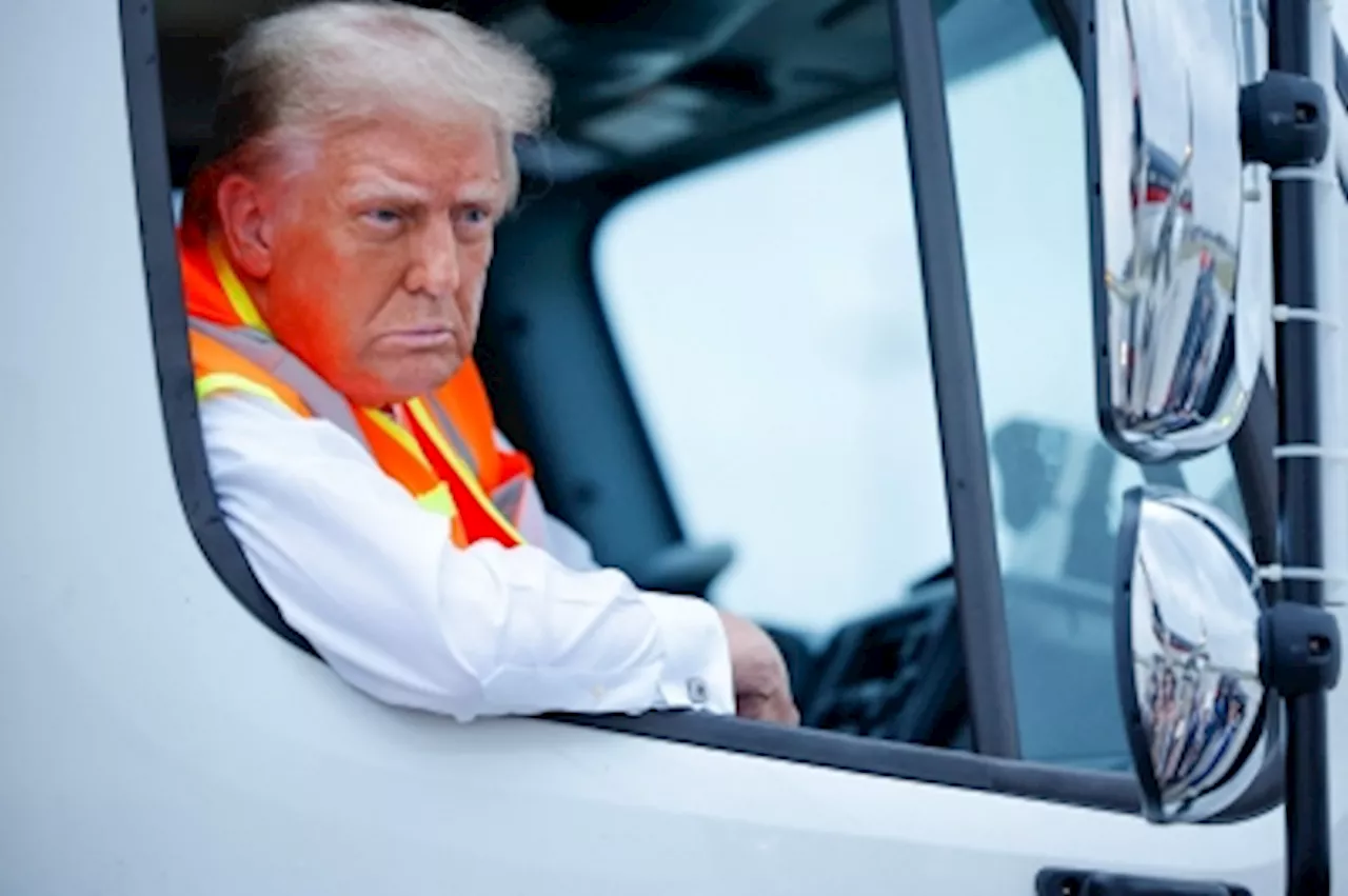 Trump rides a garbage truck, trash talk Harris after Biden’s ‘garbage’ gaffe