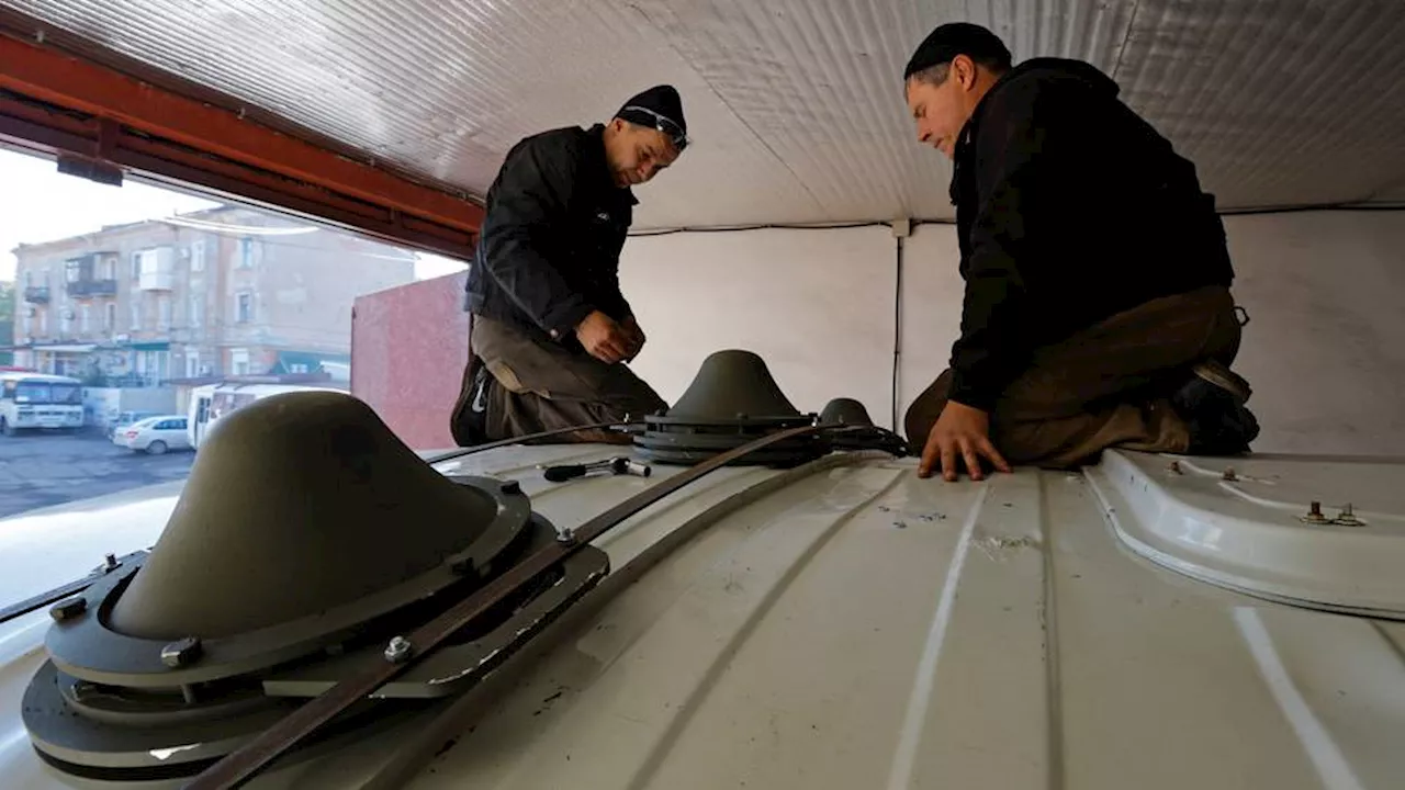 Russian-held town in eastern Ukraine equips buses with drone jammers