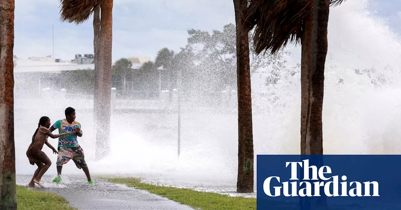 Florida man rescues neighbors on surfboard after Helene floods island city