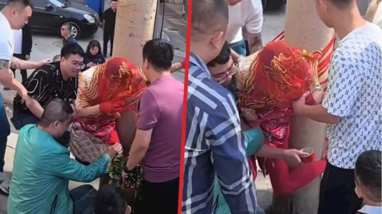 Shock video of China bride taped to phone pole reignites debate over vulgar wedding hazing