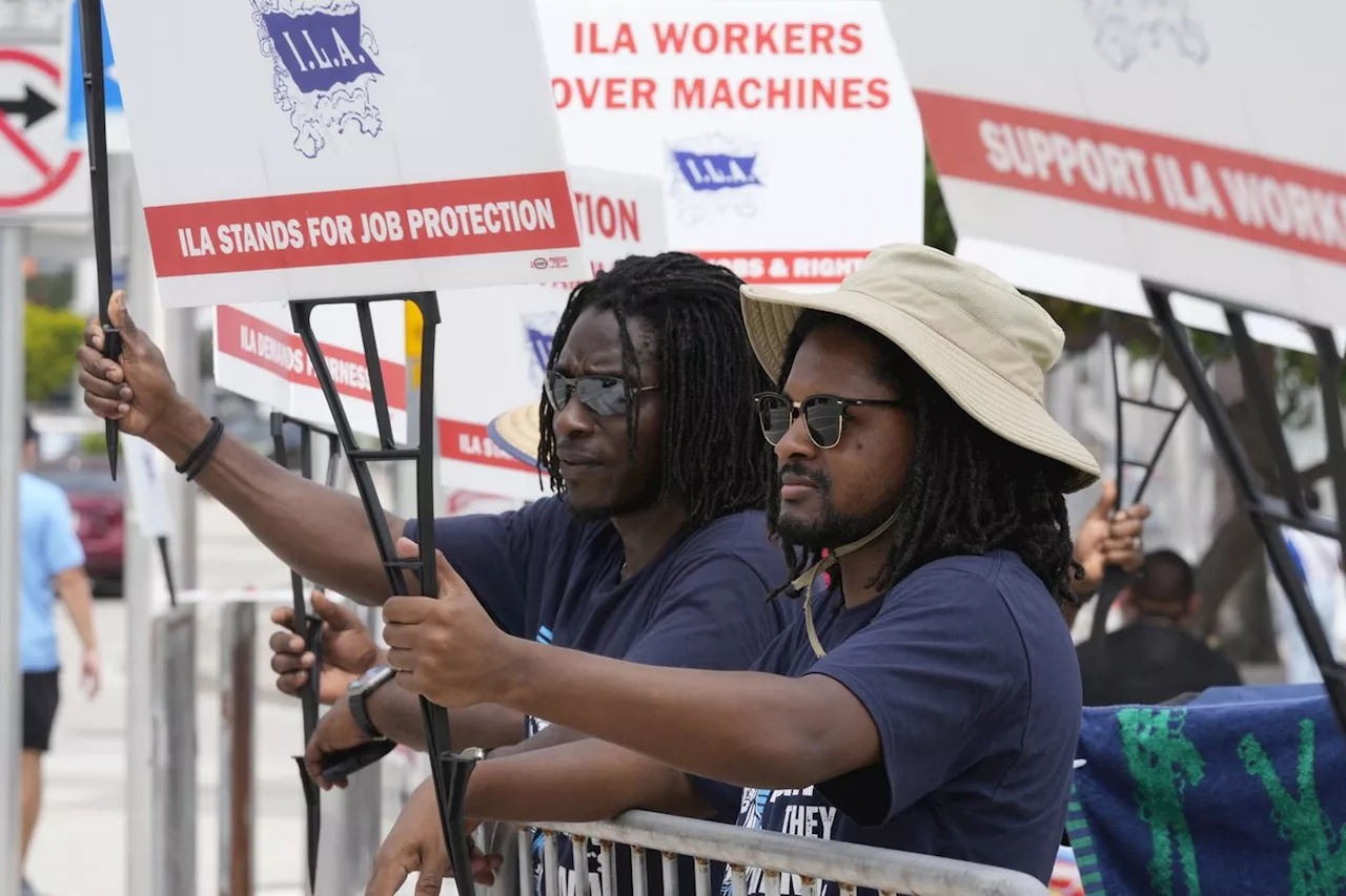 Dockworkers' union to suspend strike until Jan. 15 to allow time to negotiate new contract