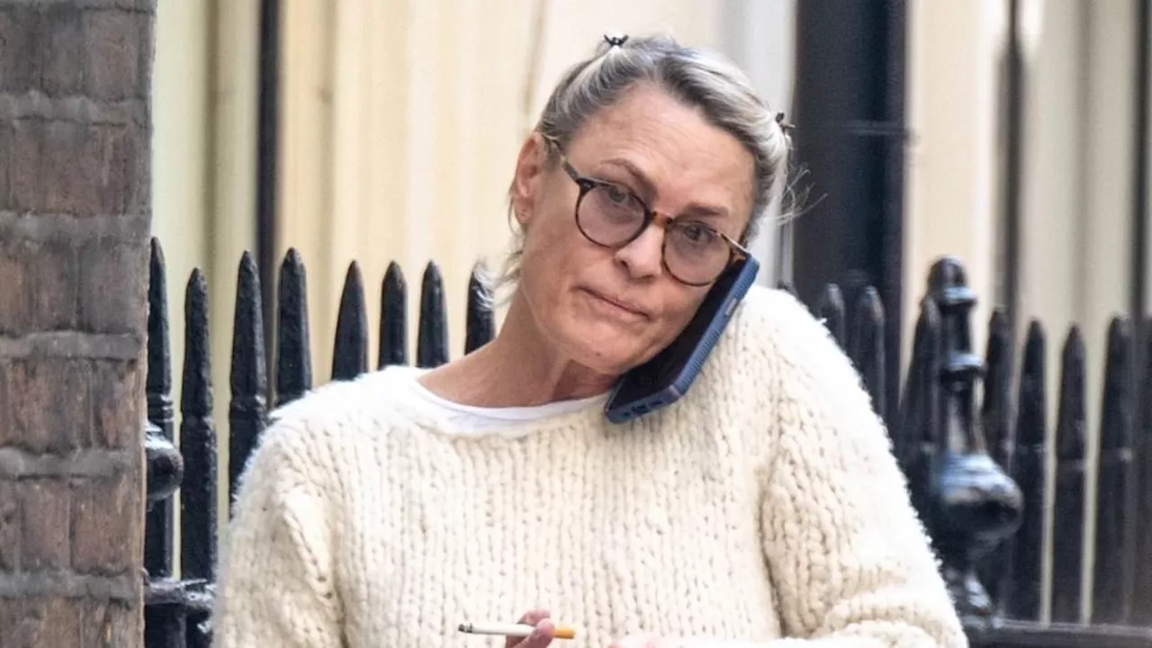 Golden Globe-winning actress, 58, looks unrecognisable as she puffs on a cigarette in London amid...