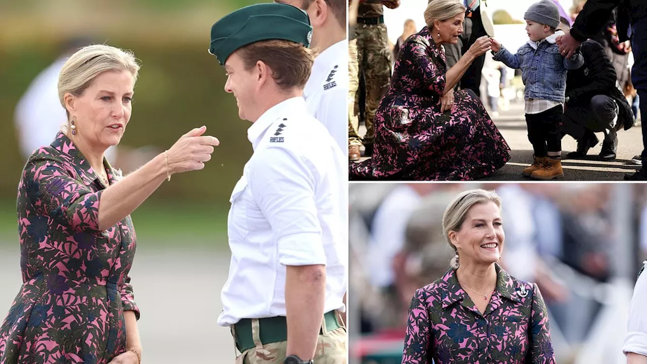 Duchess of Edinburgh plucks spider from an officer's shirt during visit to a military camp